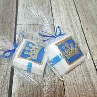 little prince crown favors made with white soap in gold and blue laying on the side tied with blue ribbon