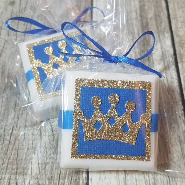 Little prince baby shower favors blue and gold paper design on white soaps tied with a ribbon and personal tags